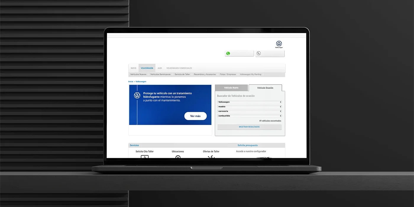 Laptop mockup displaying a custom website banner design for a Volkswagen car service promotion advertising a rain repellent treatment.